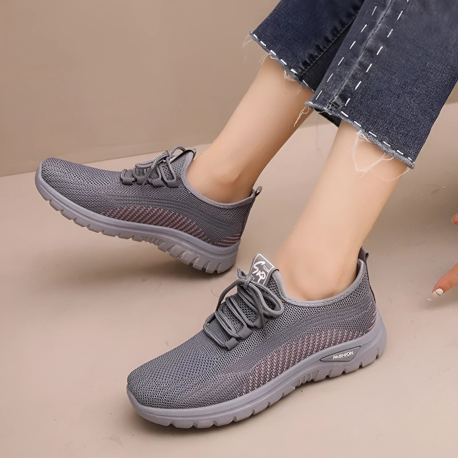 Women's breathable mesh lace-up sneakers with cross straps, round toe, and low heel in black, gray, and purple