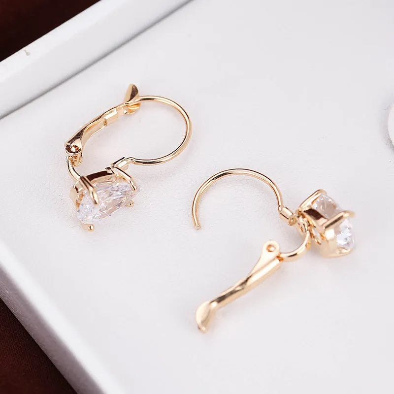 Drop-shaped women's fashion earrings with platinum inlaid gems in gold and platinum colour options