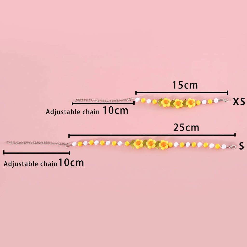 Colourful plastic bead pet necklace for dogs and cats in small flower, rainbow, or peach patterns.