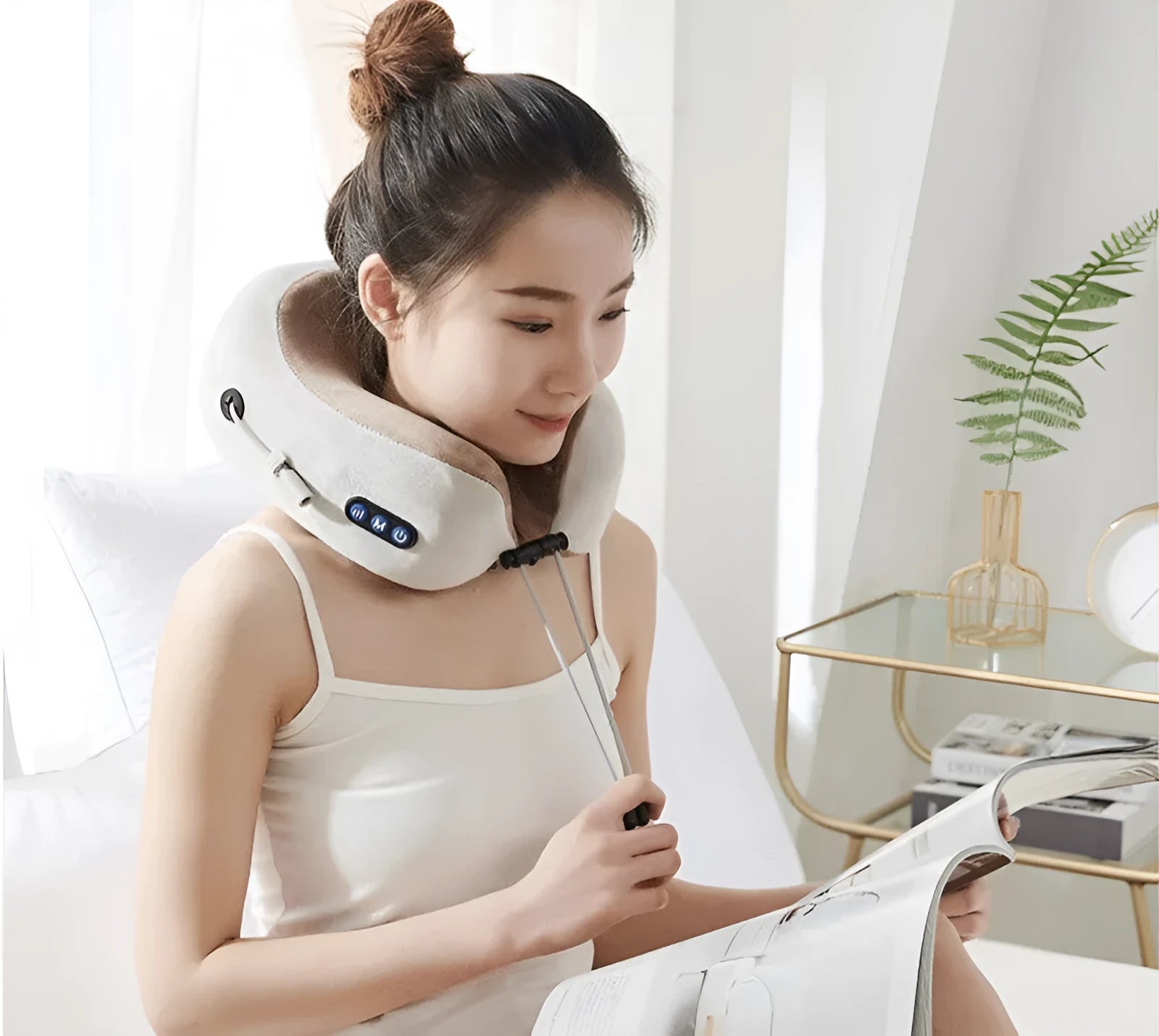 Brown U-shaped electric neck massager pillow with massage heads visible