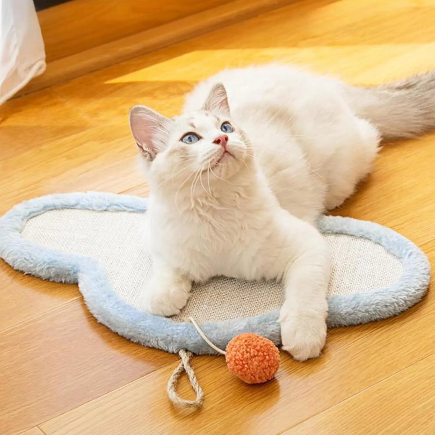 White wall-mounted cat scratching mat with sleeping cat pattern design made from natural sisal