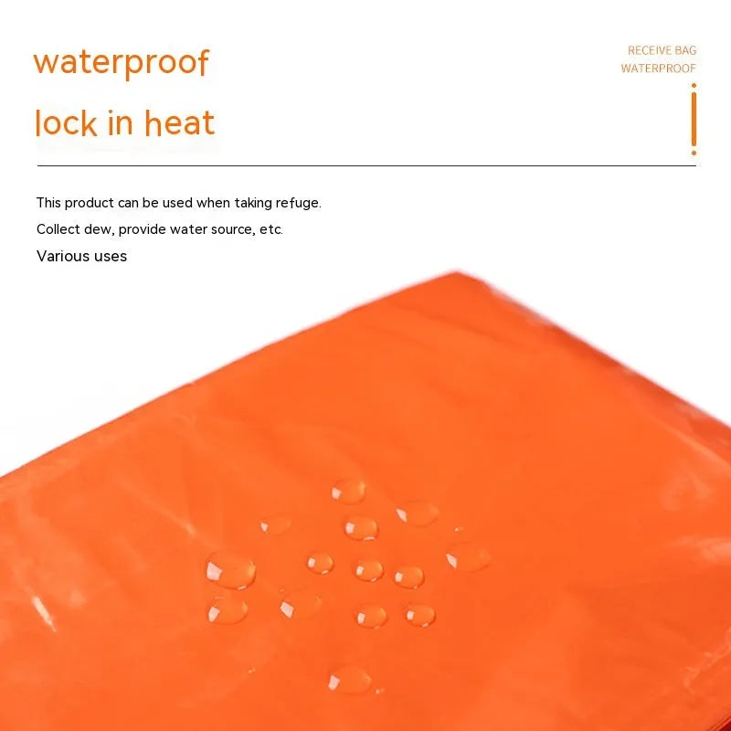Portable orange disaster relief tent with sleeping bag and raincoat emergency shelter system