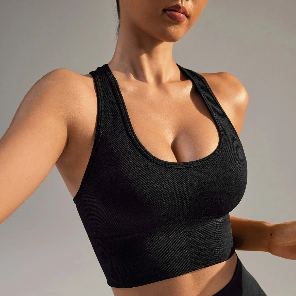 Quick-drying breathable sports bra for women in black with cross back design