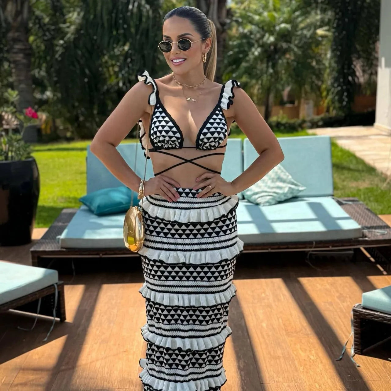 Women's striped bikini set with ruffled spaghetti straps top and long knitted skirt in black and white stripes