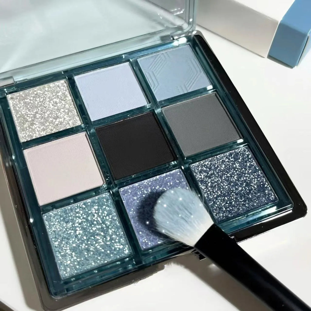 MUGELEEN nine-colour eye shadow palette showing blue smokey shades with matte and shimmer finishes