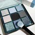 MUGELEEN nine-colour eye shadow palette showing blue smokey shades with matte and shimmer finishes