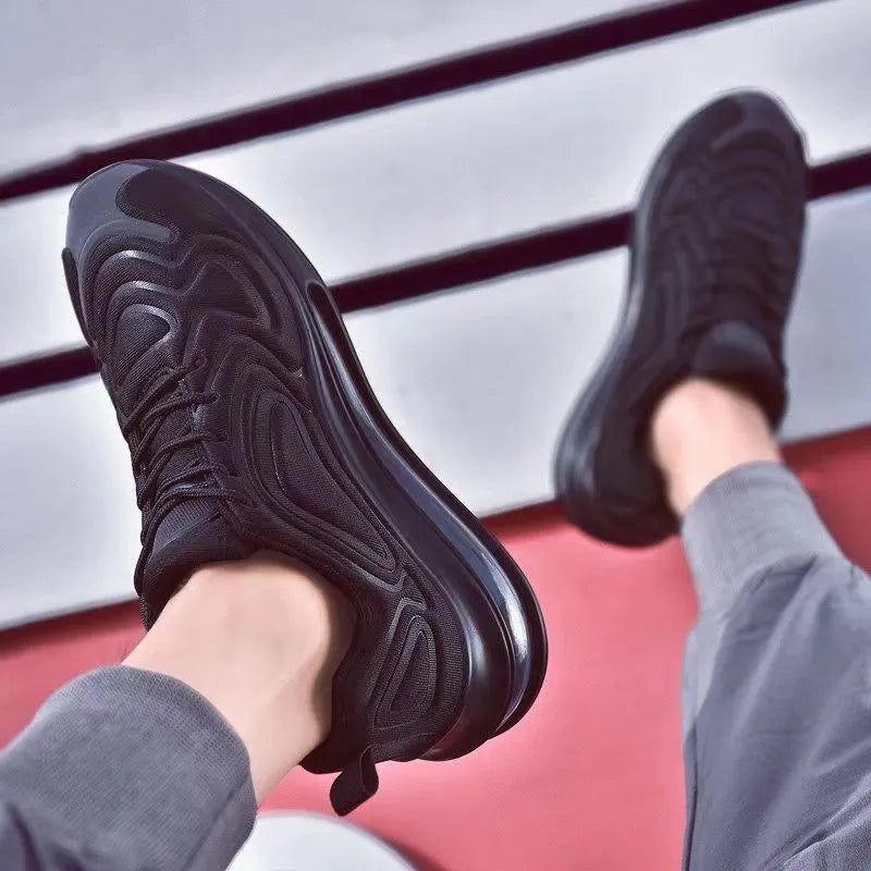 Men's black casual sneakers with a thick sole and lace-up design for running and sports.