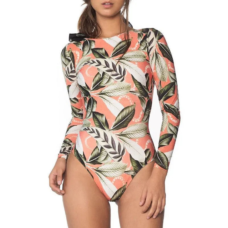 Women's green leaf print one-piece swimsuit on a mannequin, back view.