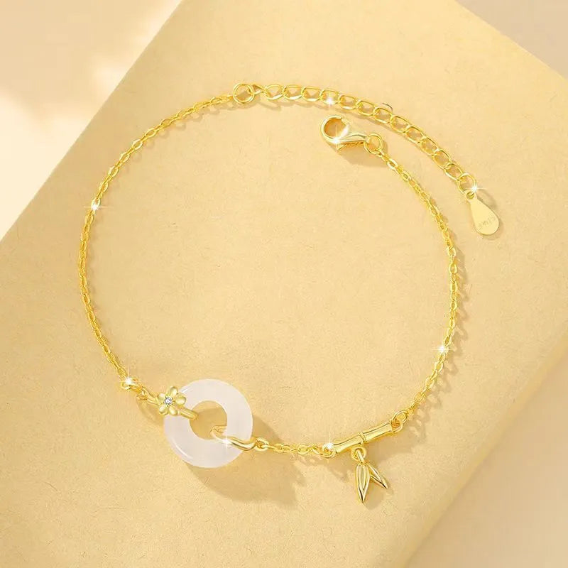 White chalcedony bracelet with peace buckle in silver gold electroplated finish on silver base