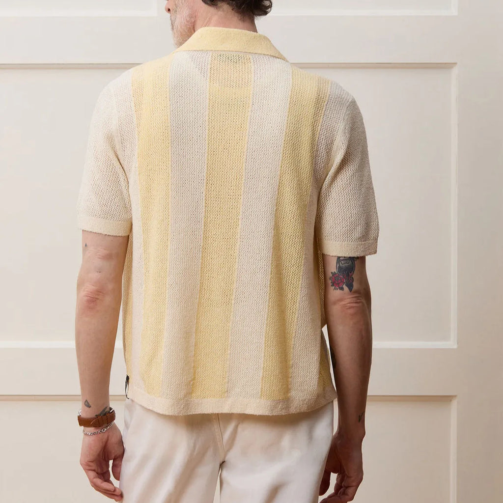 Yellow men's short-sleeve polo shirt with hollow-out design and asymmetric cut.