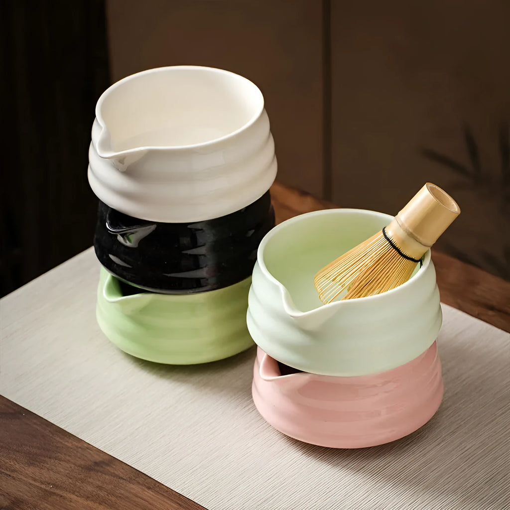 Ceramic matte tea whisk stand in Japanese style on a neutral background with a tea whisk placed upright inside the holder