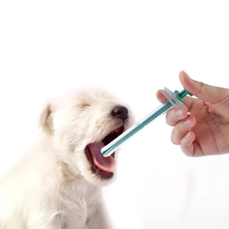 Two silicone-tipped pet pill shooters in different sizes on a white background.