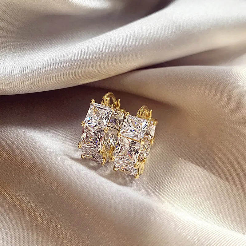 Geometric U-shaped women's ear rings with gold electroplating and zircon crystals