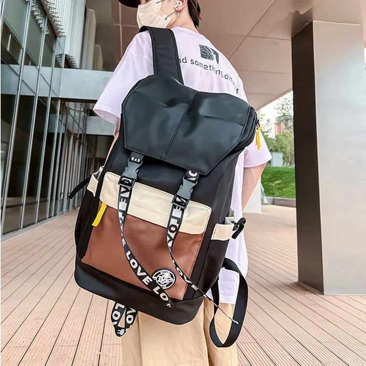 Oxford cloth backpack in black, green, or red with handheld and shoulder straps