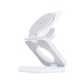 Foldable magnetic wireless charger in black with smartphone placed on charging pad