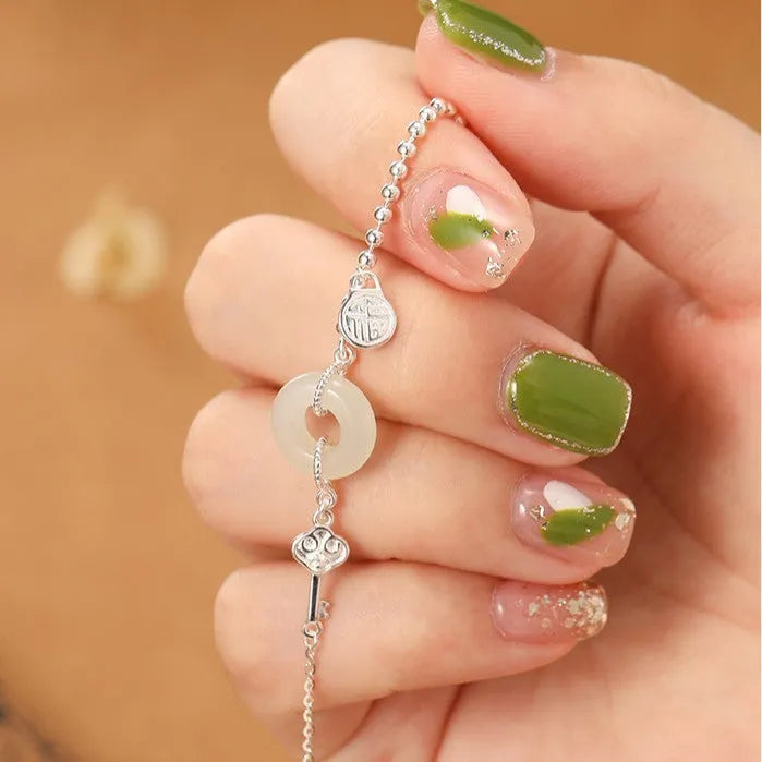 Silver Hetian jade bracelet with blessing card and peace buckle design in geometric Chinese style