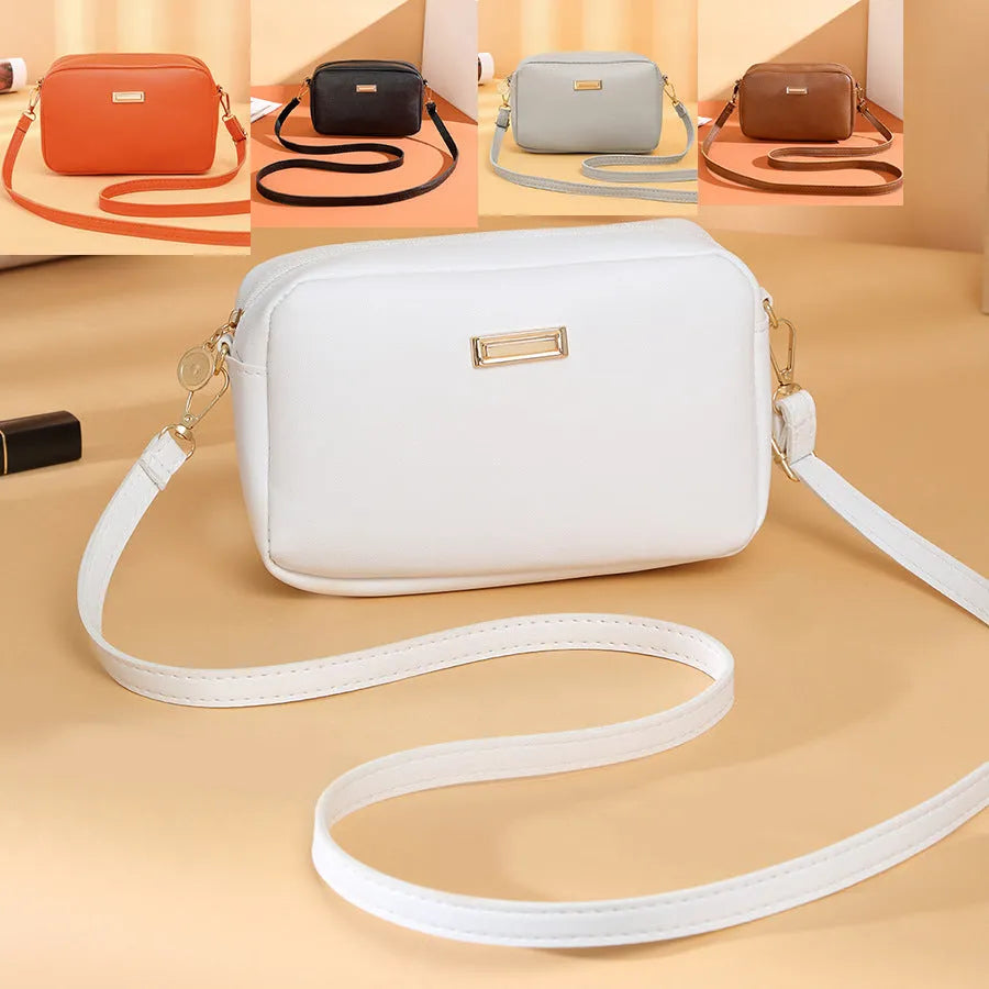 Women's square shoulder bag in PU material with a 3D front pocket, shown in a solid colour.
