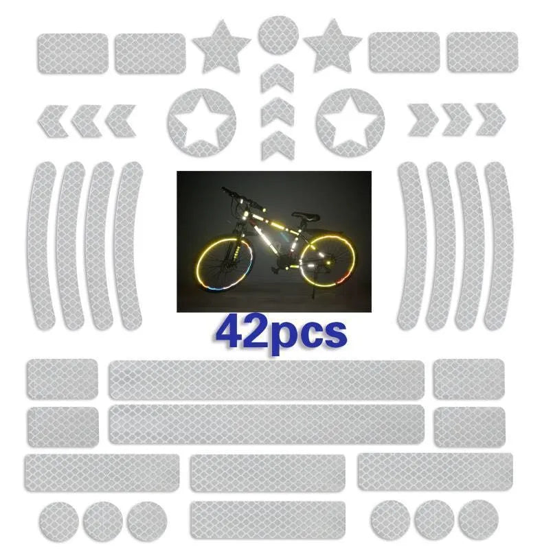 Reflective grid pattern safety tape for bicycles in red, yellow, blue, and white colours.