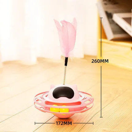 Pink cat tumbler turntable toy with rotating base and attached stick on white background