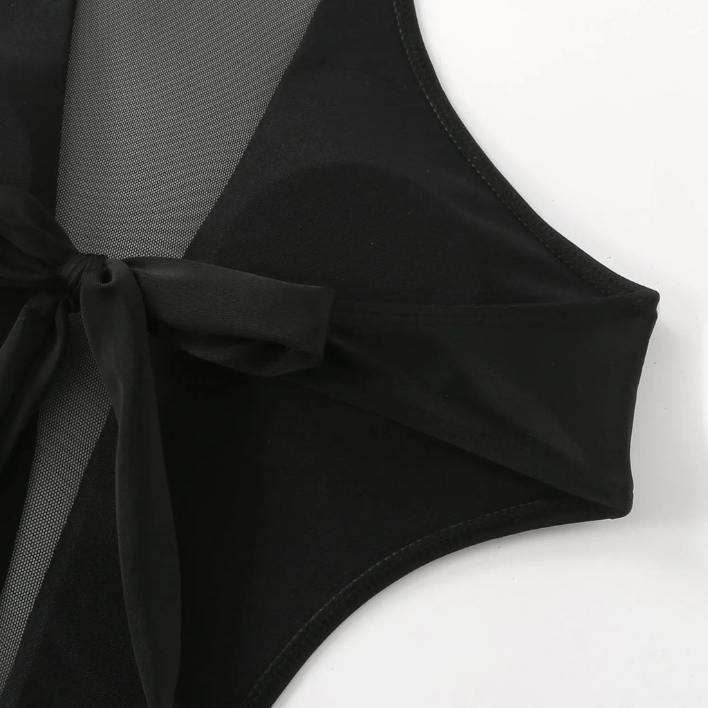 Women's black one-piece swimsuit with nude back hollow-out strap, polyester fabric, front view.