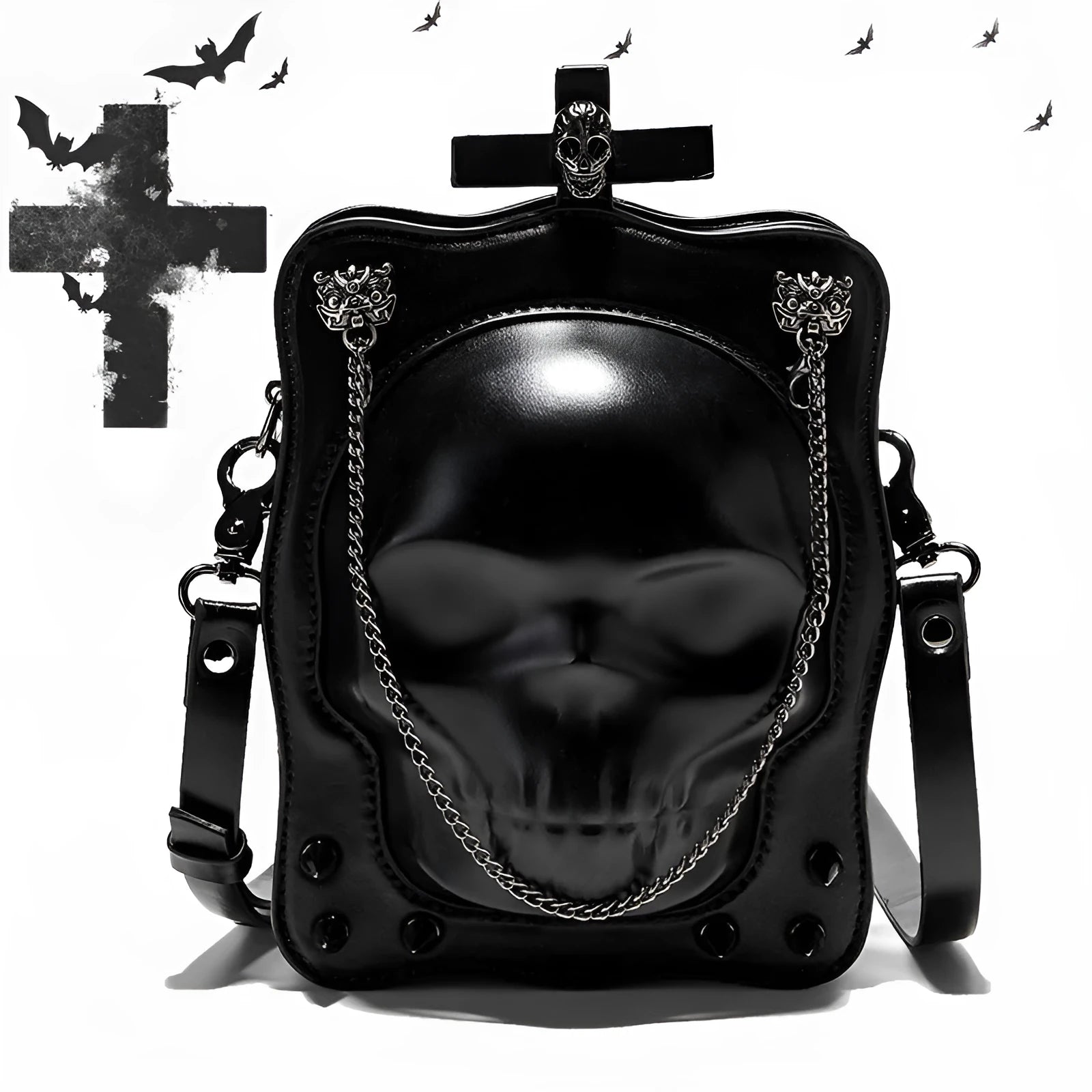 Black mini square crossbody bag with embossed skull design, chain accents, and zipper closure