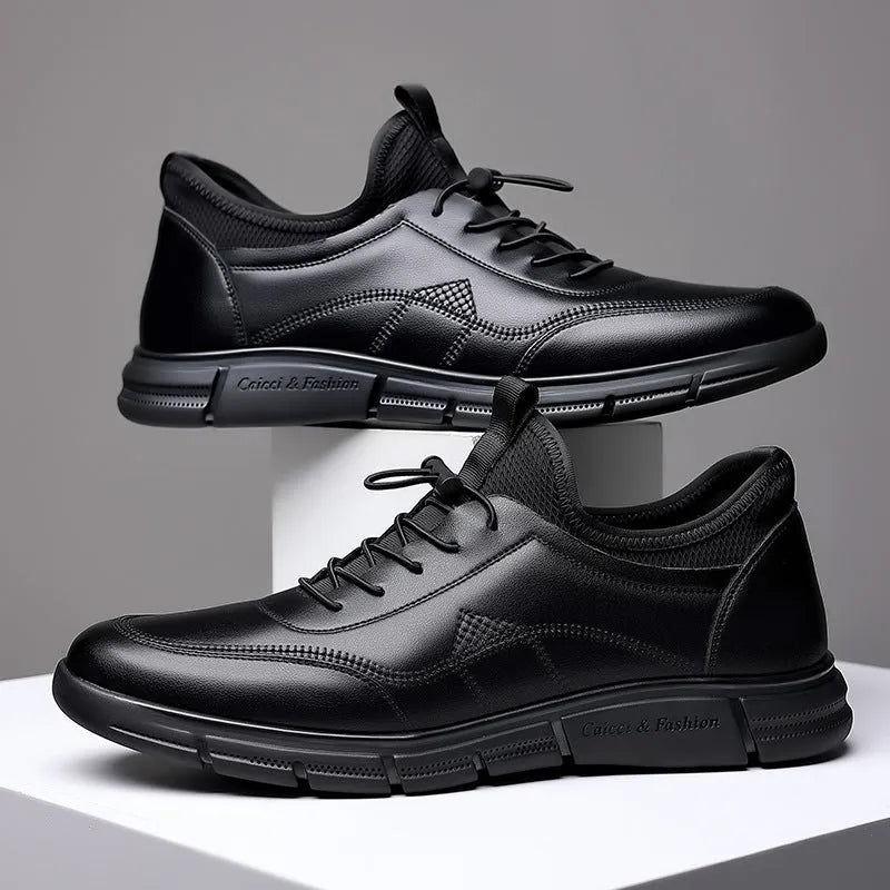 Men's black low heel casual shoes with round toe and square heel on a plain background