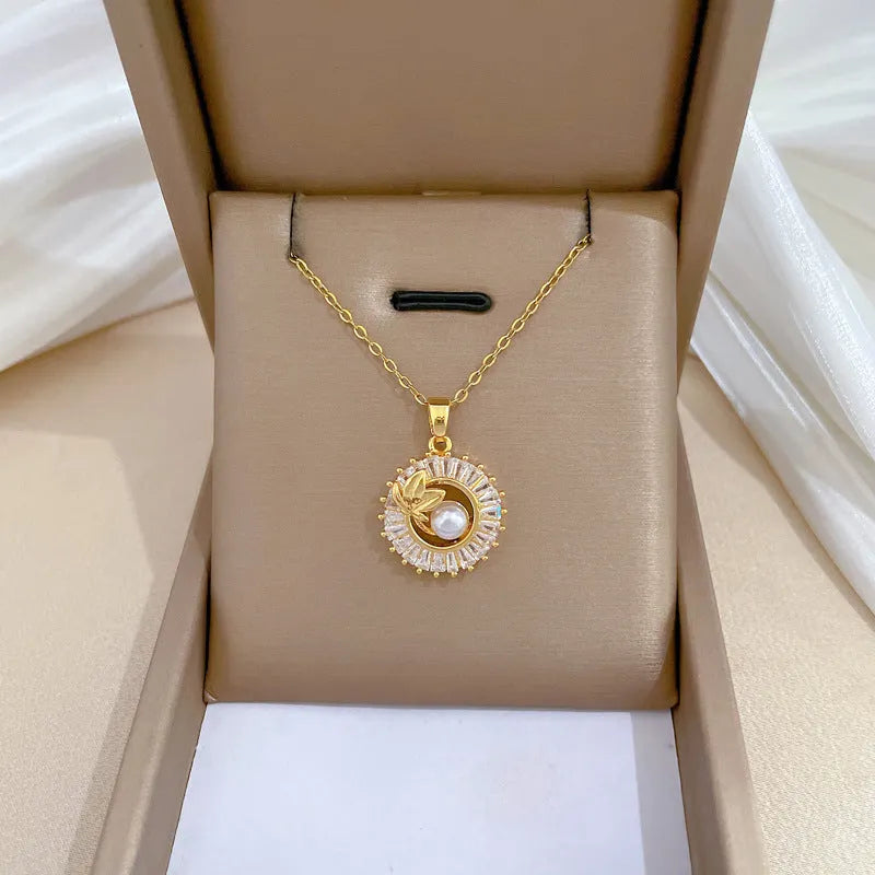 Titanium steel geometric jewellery set with round ring, square pendant necklace, and leaf-shaped stud earrings on a silver-tone chain.