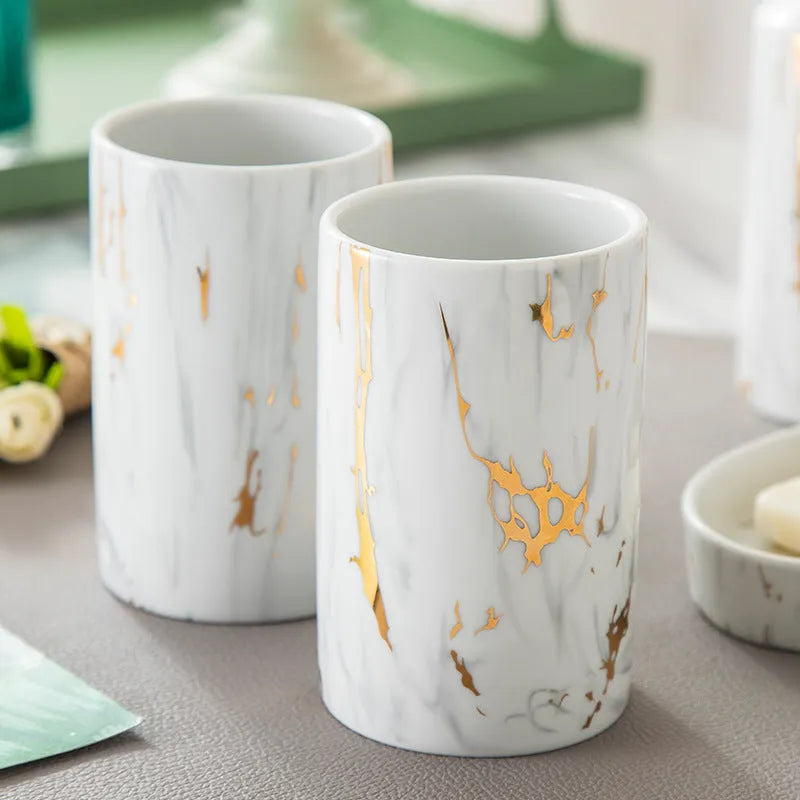White ceramic marble effect bathroom wash kit with two cups, latex bottle, and soap box in colour box