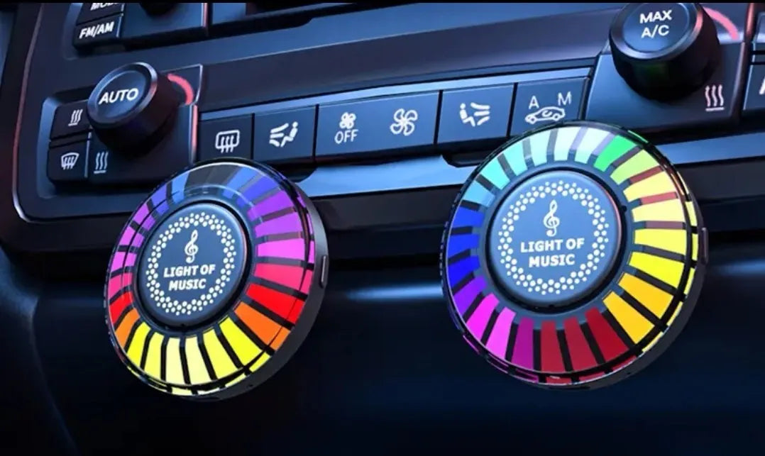 Car air vent aromatherapy diffuser with RGB LED lights mounted on vehicle air outlet