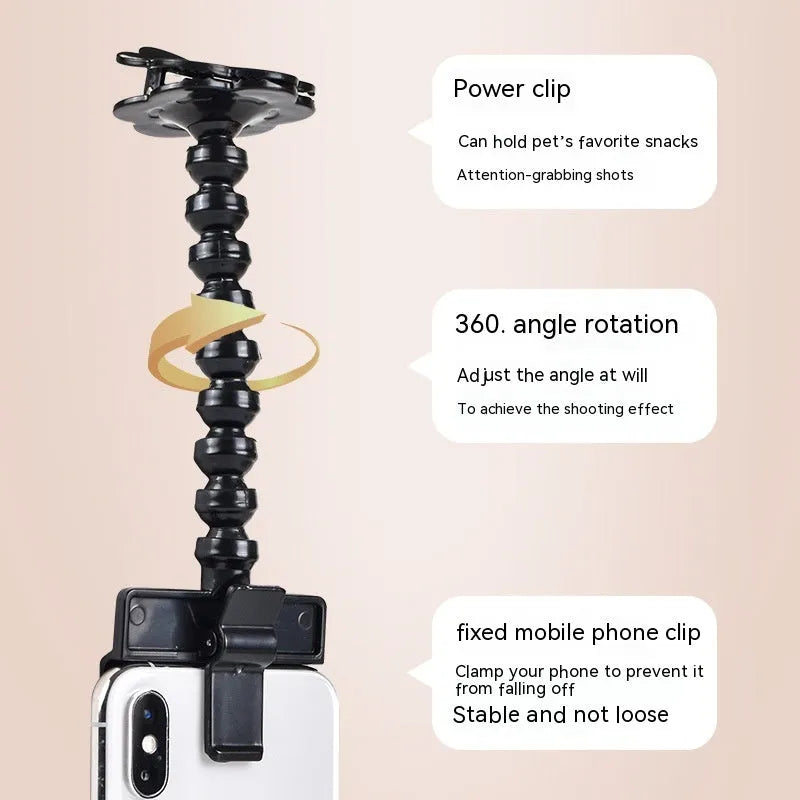 Pet photography tool with black plastic phone clip and snack holder for dog selfies
