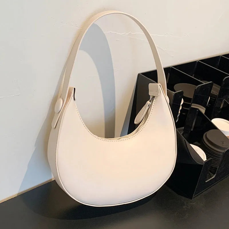Retro women's shoulder bag in dumpling shape with zip compartment in black, white, cream yellow or brown