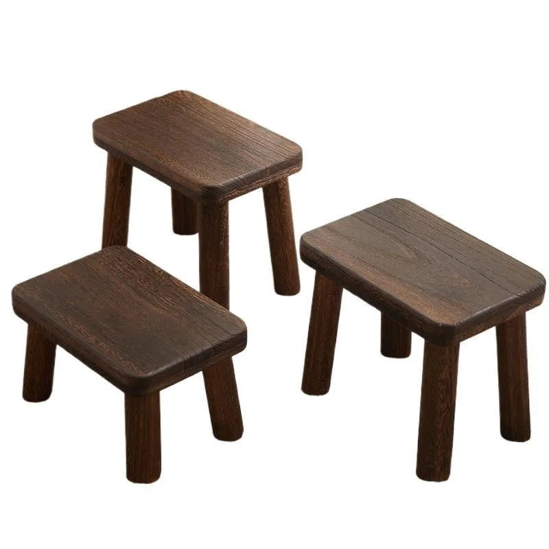 Solid wood distressed finish changing stool with bracket structure.