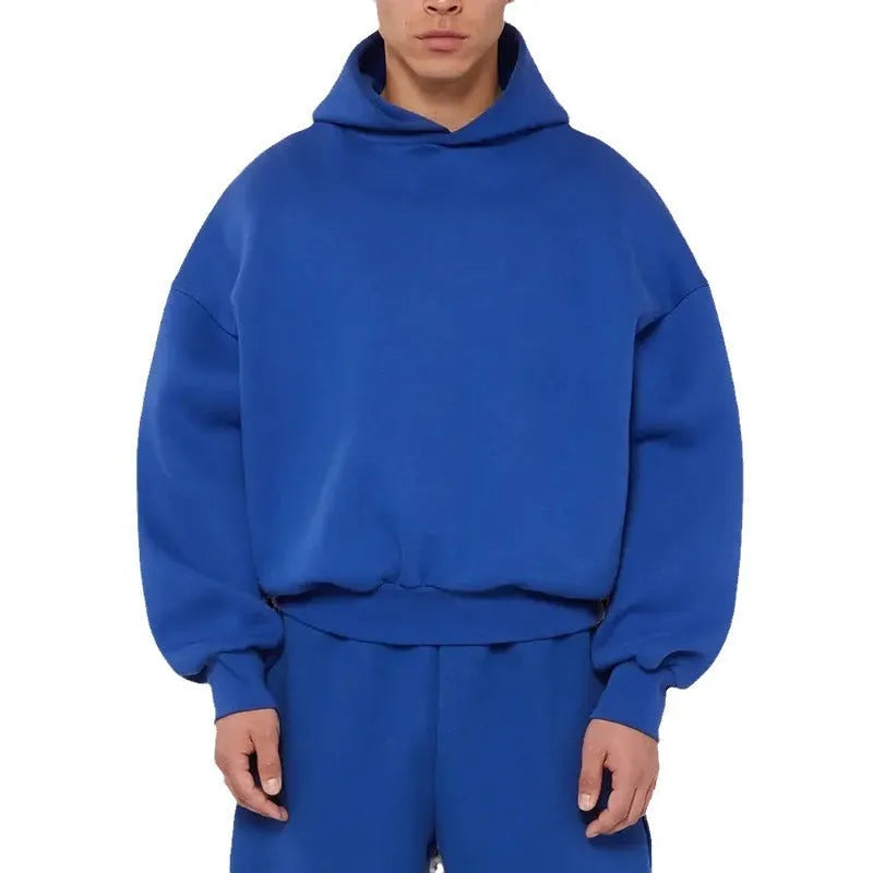 Men's grey cotton pullover hoodie with a fleece wool lining and long sleeves.