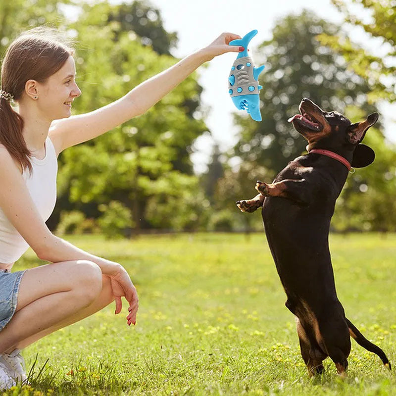 Dog teething leaky toy in blue with shark-tooth texture and vent holes