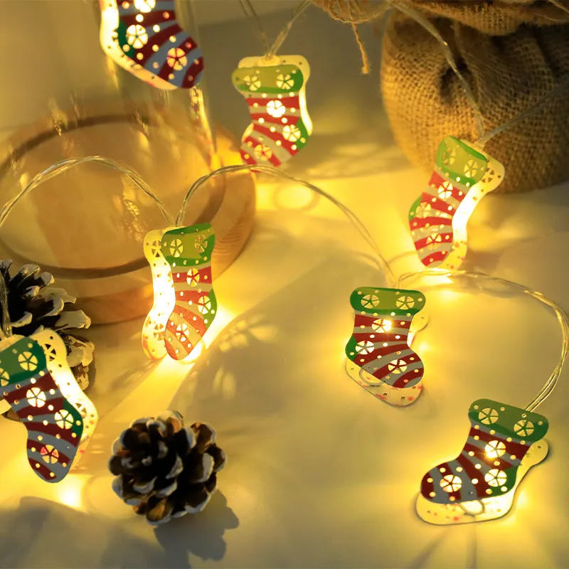 Christmas LED light string with Santa Claus, elk, and snowman ornaments on a dark background