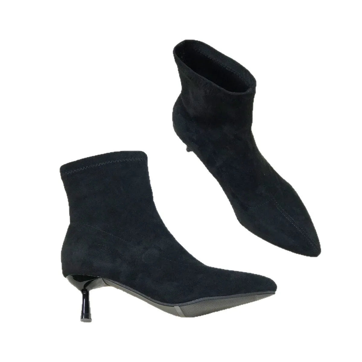 Women's black pointed toe ankle boots with a stiletto heel on a plain background