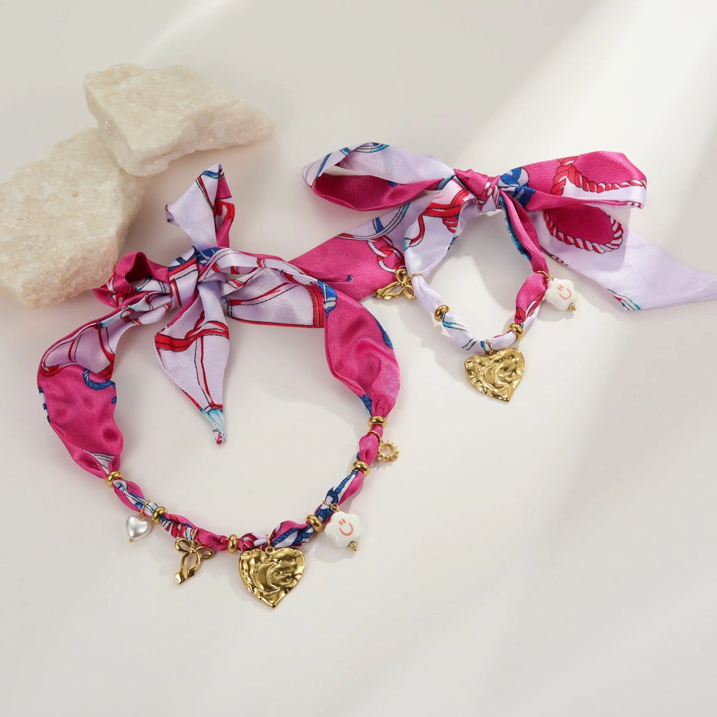Stainless steel necklace and bracelet set with colourful silk scarf pendants on geometric designs