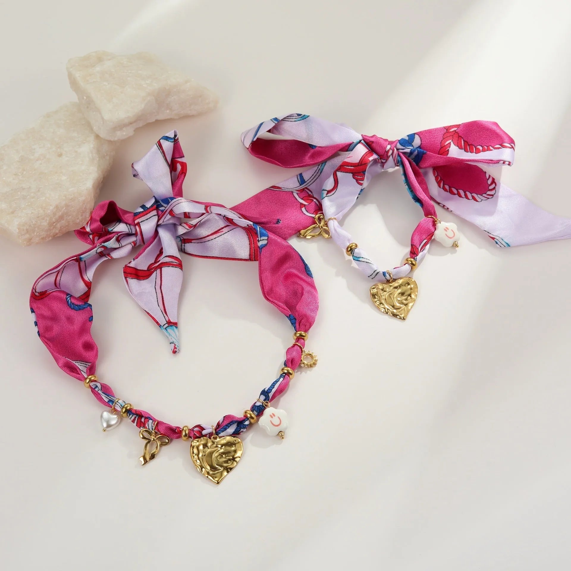 Stainless steel necklace and bracelet set with colourful silk scarf pendants on geometric designs