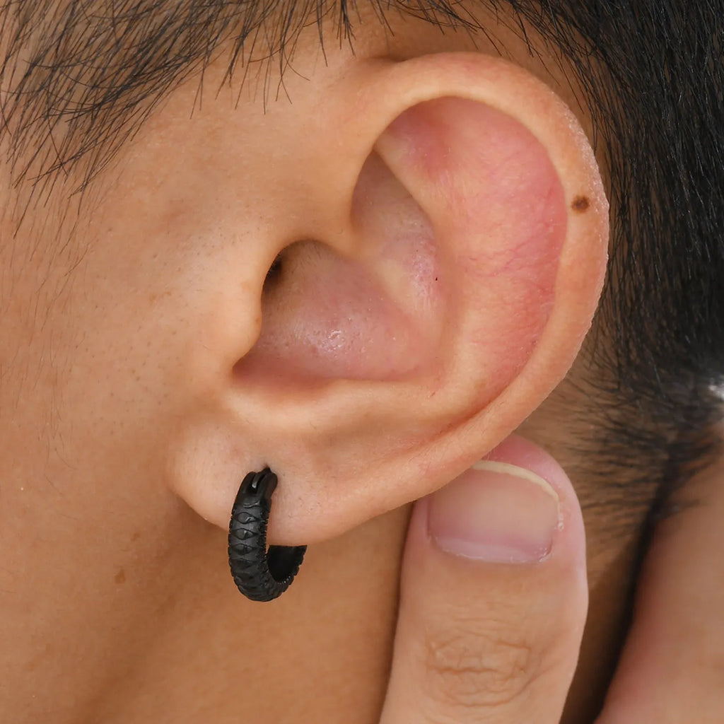 A pair of stainless steel snake pattern earrings in black or gold hip hop style.