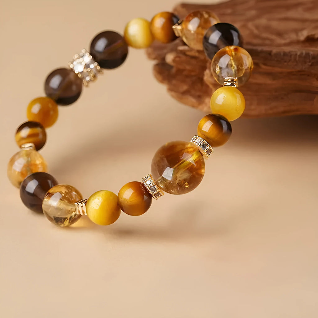 Natural tiger-eye crystal bracelet with geometric beads in either 10mm or 12mm size on a wrist.