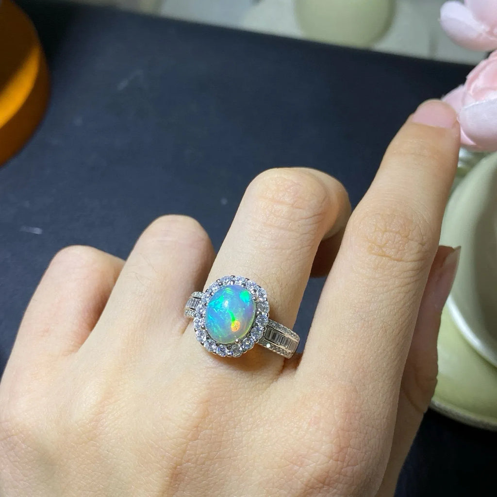 Handmade natural opal silver ring in gold colour with adjustable opening on hand