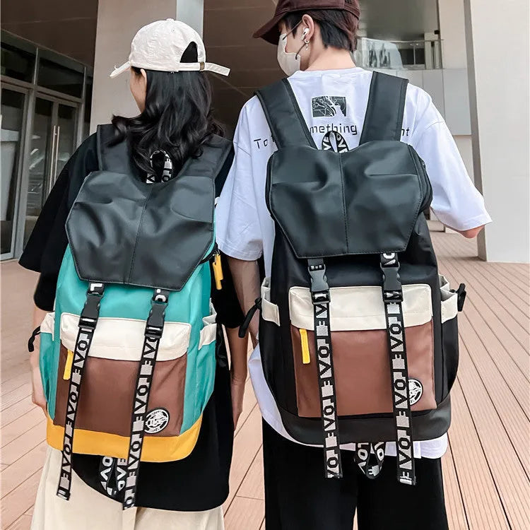 Oxford cloth backpack in black, green, or red with handheld and shoulder straps