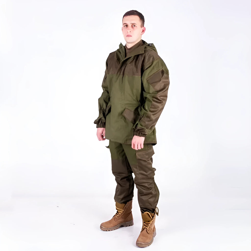 Men's special forces tactical jacket and trousers set in olive green, shown in an outdoor setting.