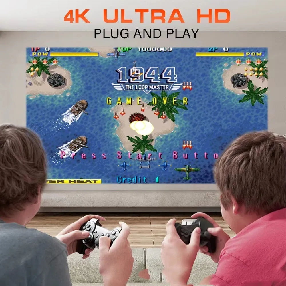 A wireless home projector with a carrying handle, displaying a bright game or movie on a wall.