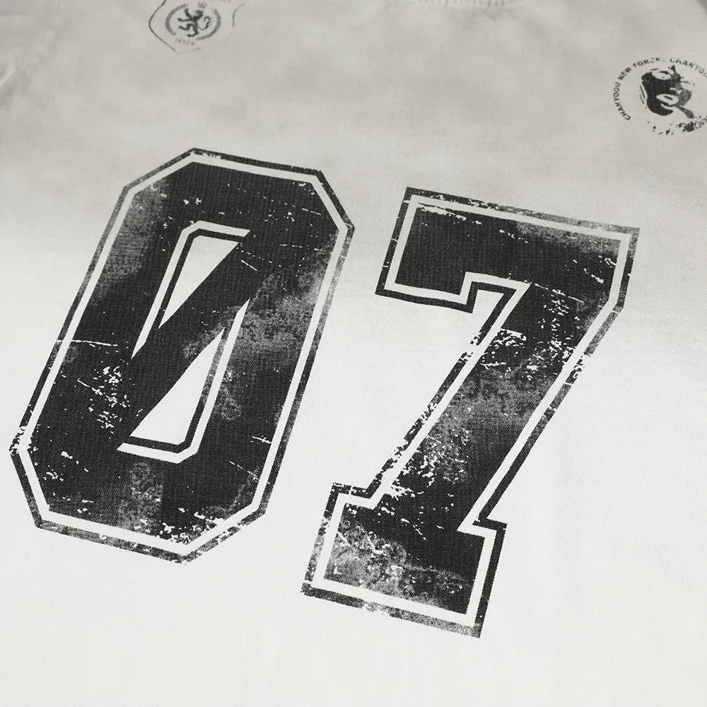 Men's black and white pure cotton short-sleeved printed t-shirt laid flat, showing sizes S M L XL.