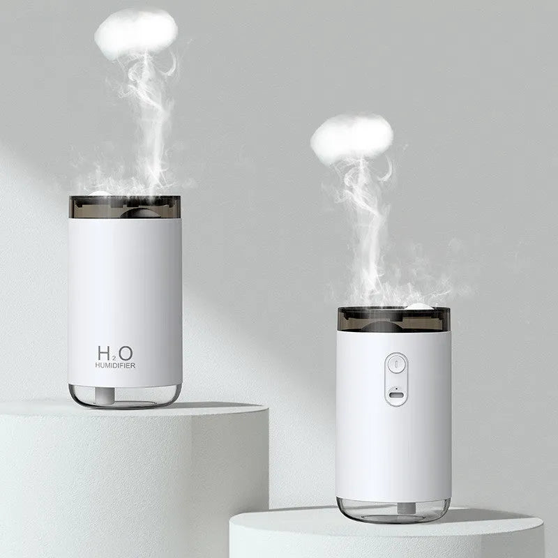 USB jellyfish humidifier creating smoke ring mist patterns with warm night light illumination