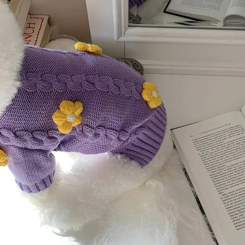 Purple knitted flower print dog coat on a pet showing pull-on style