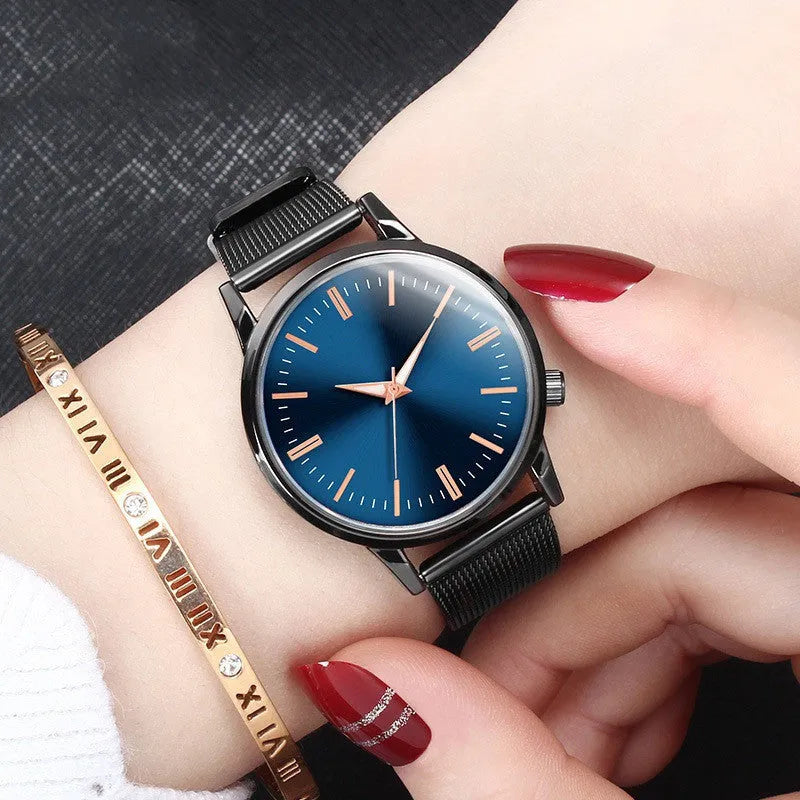Men's and women's couple watch set with blue metal mesh band, luminous dial, and alloy case on a white background