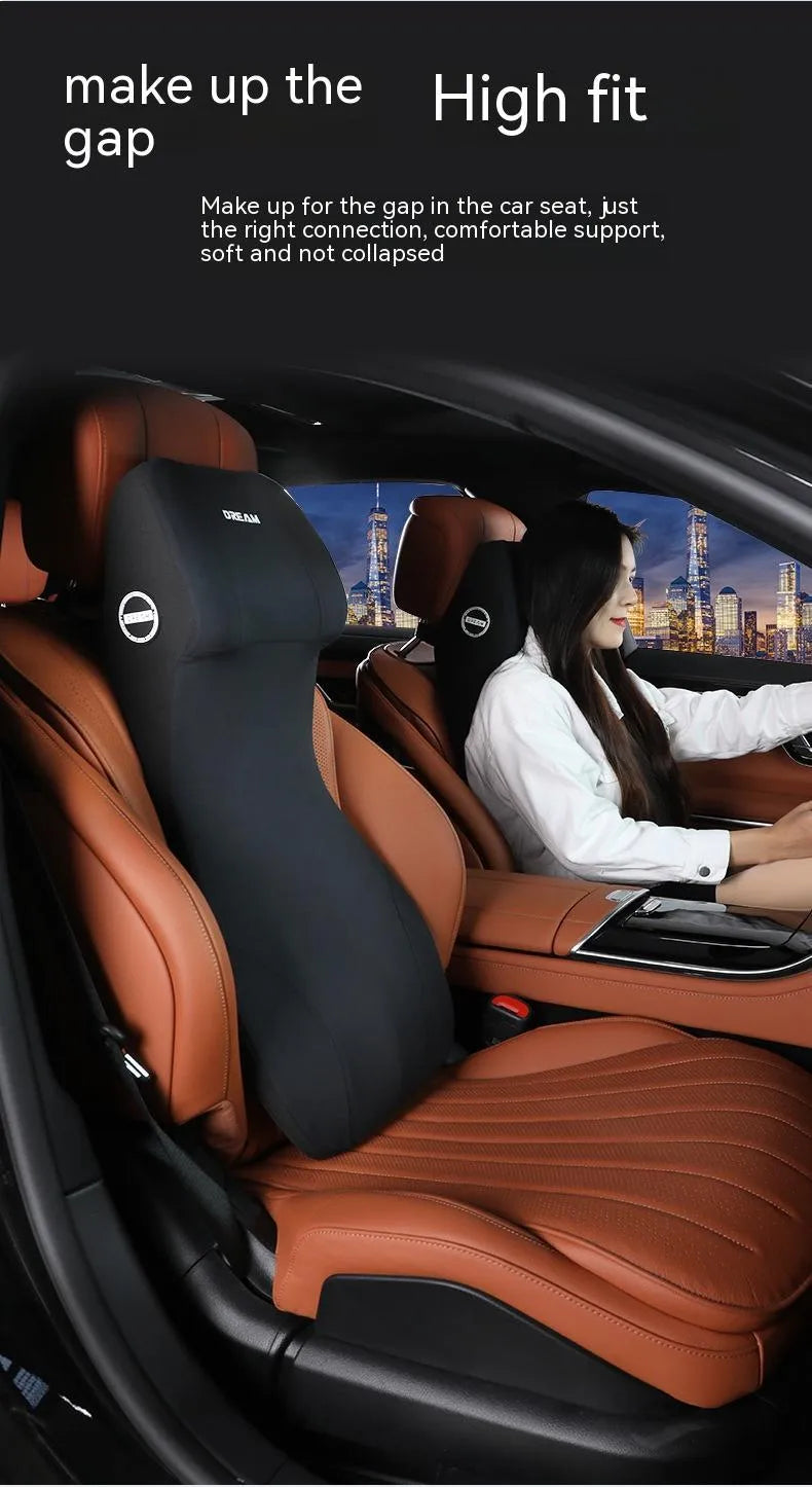 Black memory foam automotive waist cushion and headrest lumbar support pillow set on a car seat.