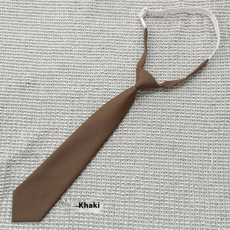 Navy blue cotton bow tie with arrow style design measuring 35cm by 7cm